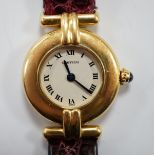 A lady's Cartier 18k Rivoli quartz wrist watch, with circular Roman dial and Cartier pouch and