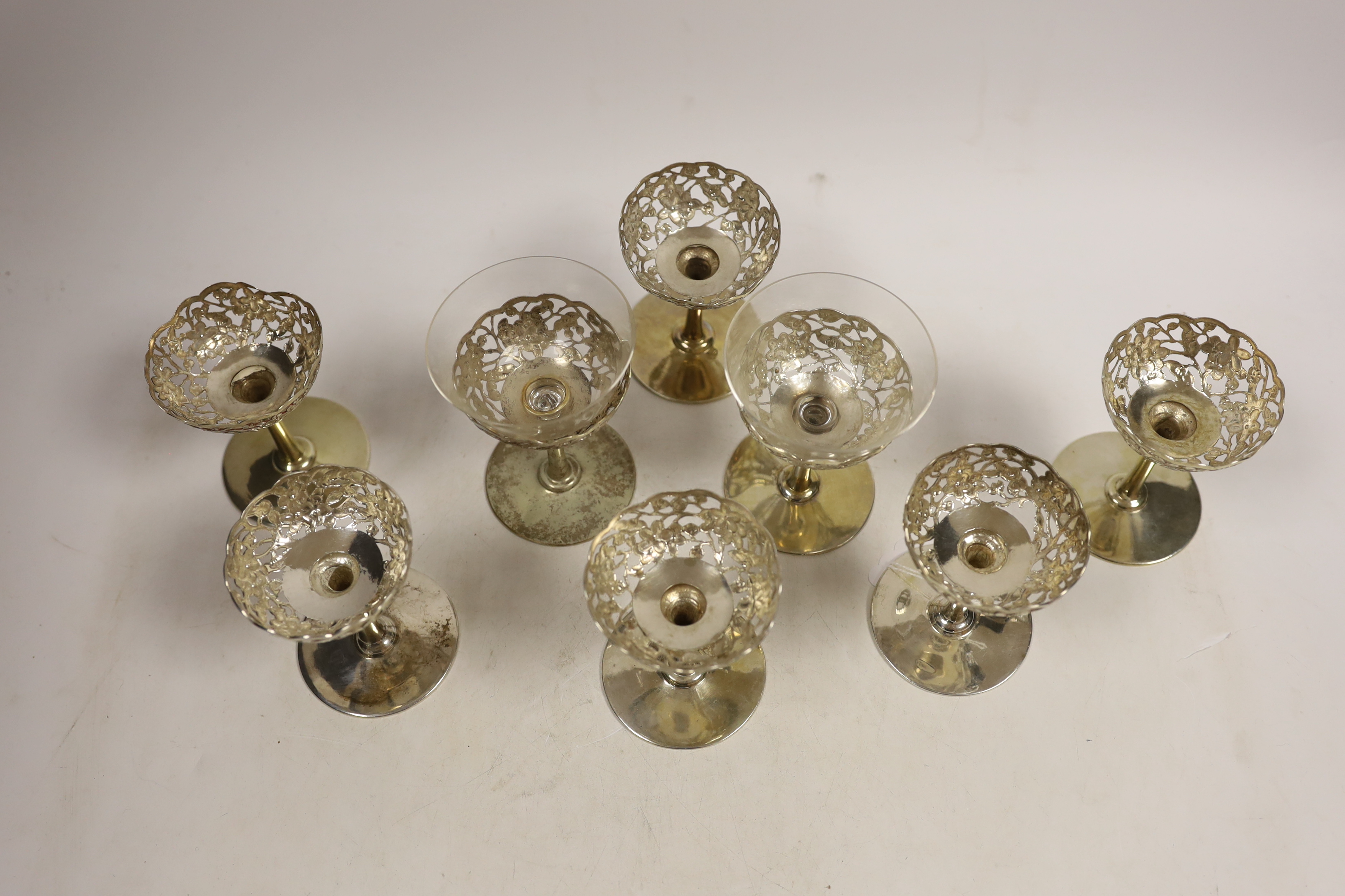 A matched set of eight pierced white metal coupes, two with glass inserts, six stamped with - Image 3 of 4