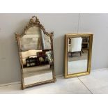 A reproduction giltwood and composition marginal plate wall mirror with ribbon crest, width 57cm,