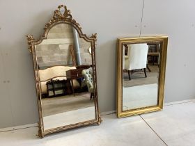 A reproduction giltwood and composition marginal plate wall mirror with ribbon crest, width 57cm,