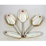 An Art Deco Mappin & Webb silver, enamel, marcasite and black opal mounted six piece mirror, comb(