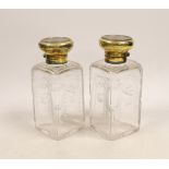 A pair of George V silver gilt mounted cut and etched glass square scent bottles and stoppers,