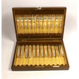A set of twelve pairs of silver fish knife blades and fork tines, Walker & Hall, Sheffield 1933,