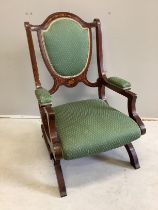 A Shoolbred Edwardian inlaid mahogany rocking chair, width 58cm, height 93cm