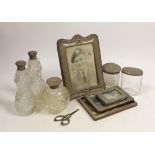 Four assorted early 20th century silver mounted photograph frames, largest 19.5cm (a.f.) five