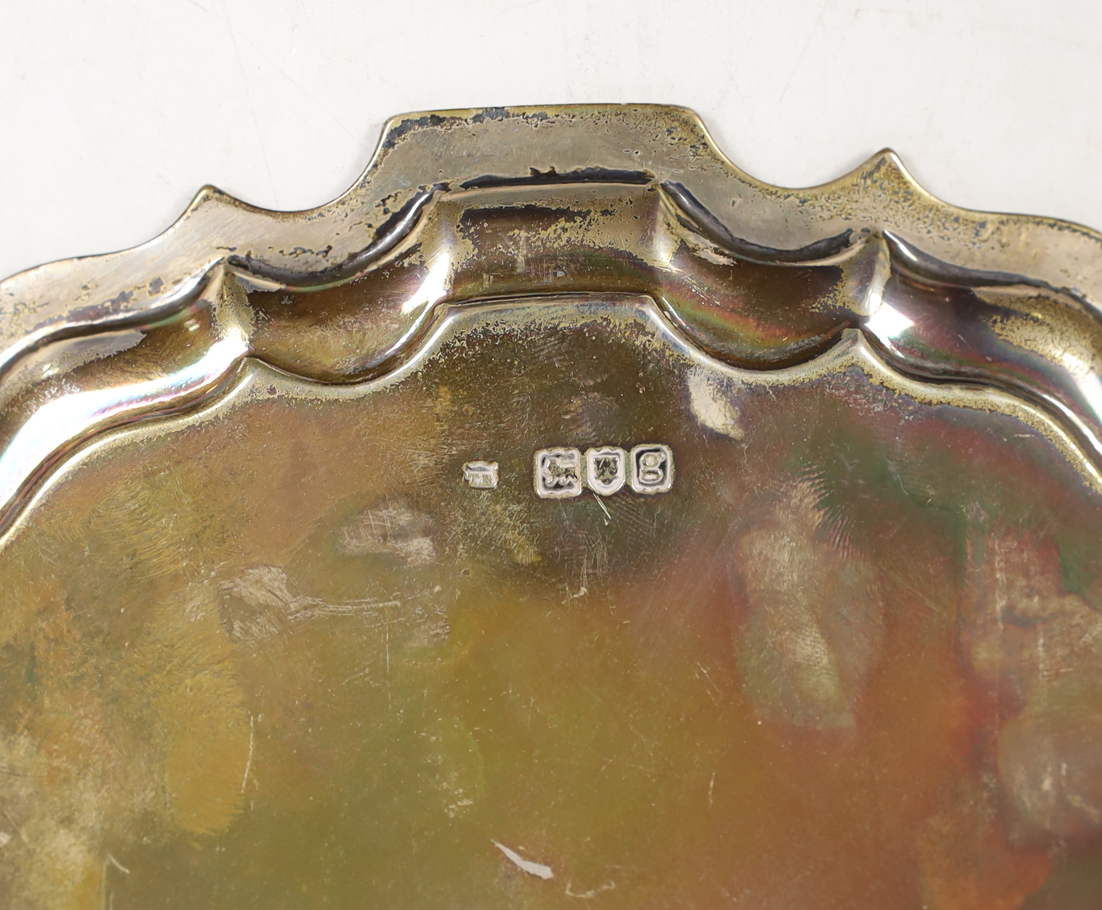 An Edwardian circular silver salver with piecrust border on three scroll feet, engraved Pilkington - Image 3 of 3