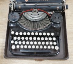 A cased Underwood typewriter, 31cm x 31cm