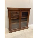 An Edwardian glazed mahogany bookcase, width 103cm, depth 27cm, height 107cm