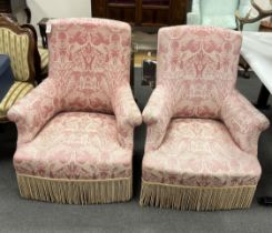 A near pair of 19th century French upholstered armchairs, width 78cm, depth 70cm, height 90cm