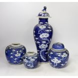 Three early 20th century Chinese blue and white jars (one with cover) and a similar vase and