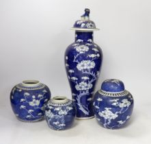 Three early 20th century Chinese blue and white jars (one with cover) and a similar vase and