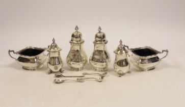 A silver condiment set comprising two salts, two peppers, two pepperettes and four spoons,