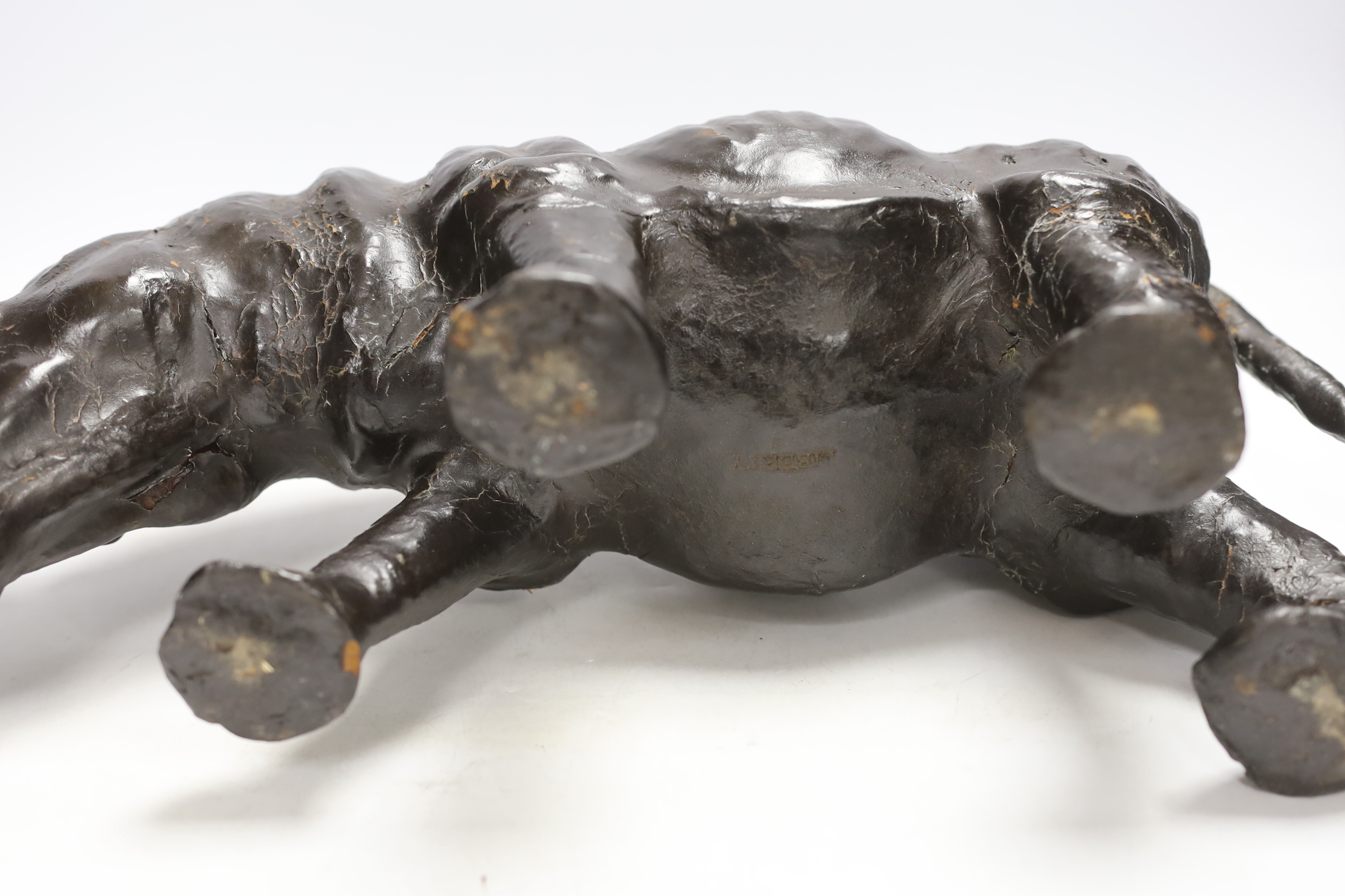 A leather rhinoceros figure with glass eyes, stamped Liberty to the underside, 54cm wide - Image 3 of 4