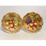 A pair of Royal Worcester fruit painted plates, post war, signed Freeman, 22.5cm