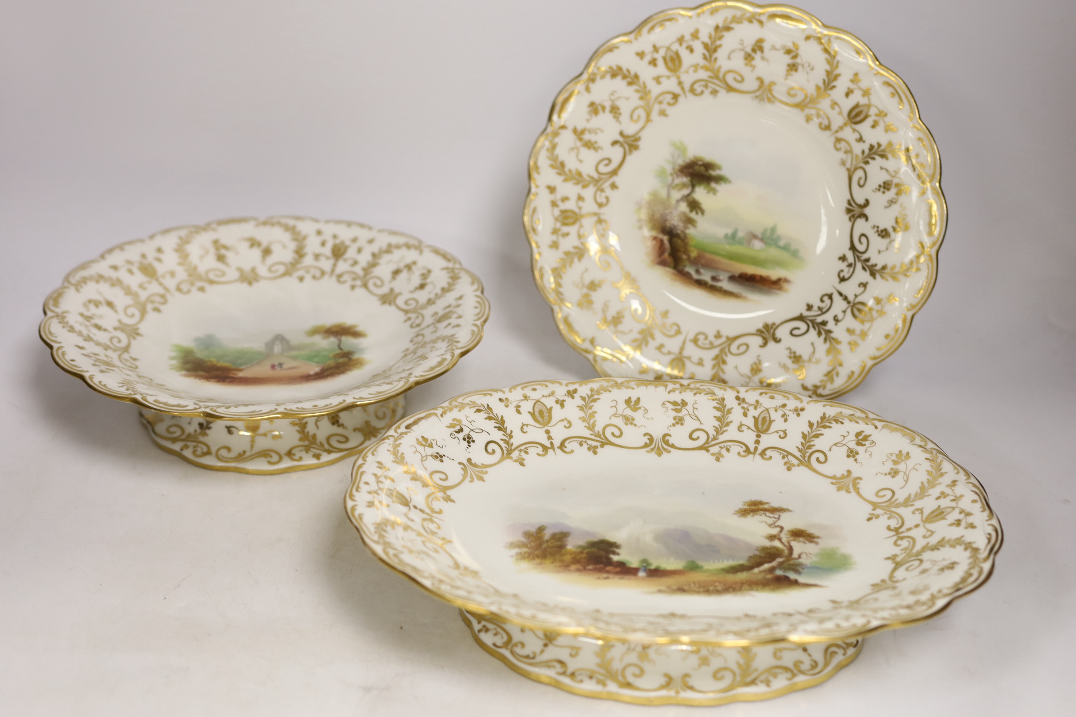 A Minton porcelain landscape painted dessert service, c.1850