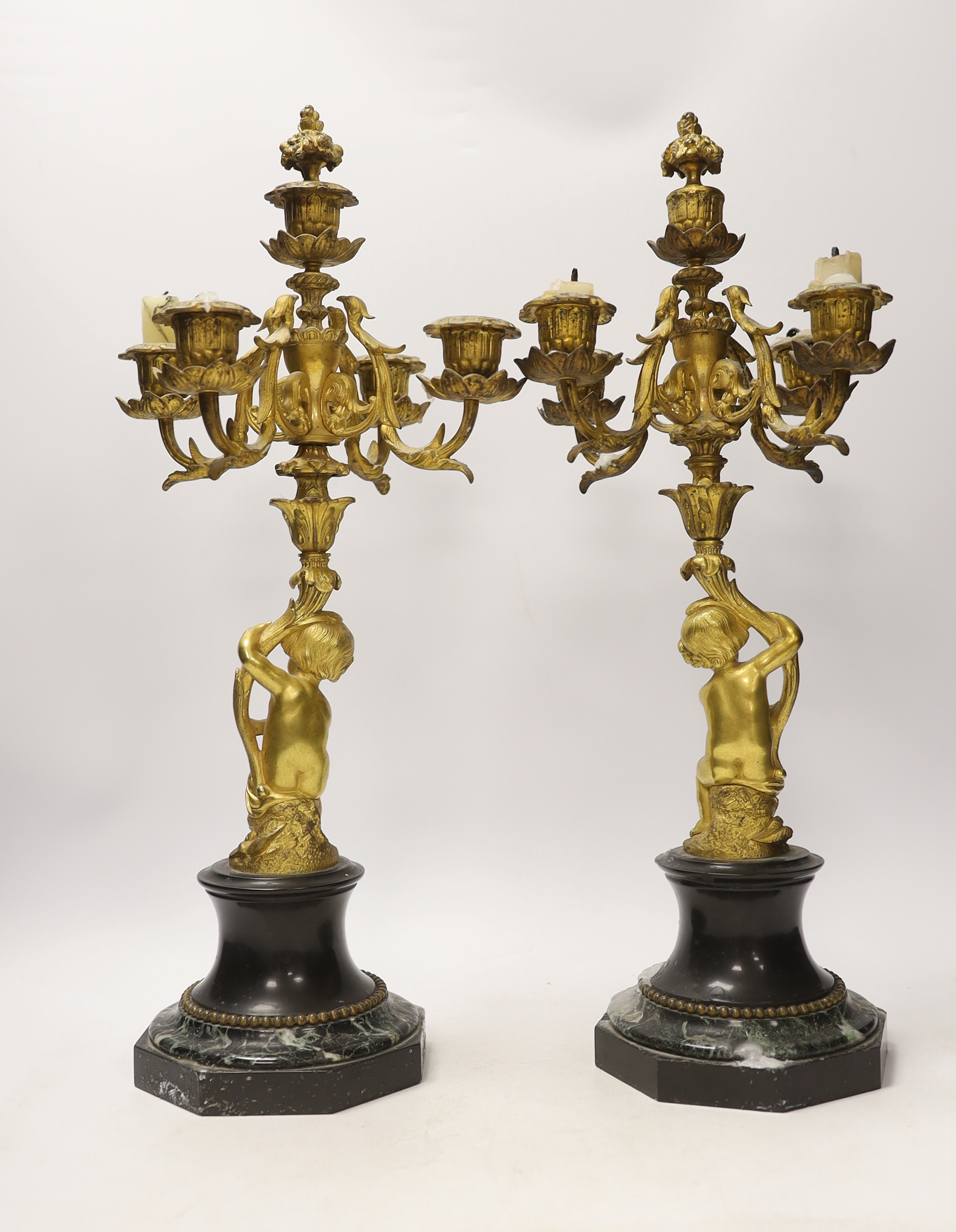 A pair of late 19th century French ormolu cherubic four branch candelabra on marble bases, 47cm - Image 4 of 4