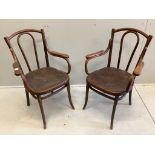 A pair of Thonet style bentwood elbow chairs, width 58cm, depth 56cm, height 92cm