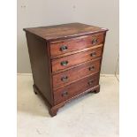 A small 19th century mahogany chest of four graduating drawers raised on bracket supports with brass