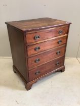 A small 19th century mahogany chest of four graduating drawers raised on bracket supports with brass