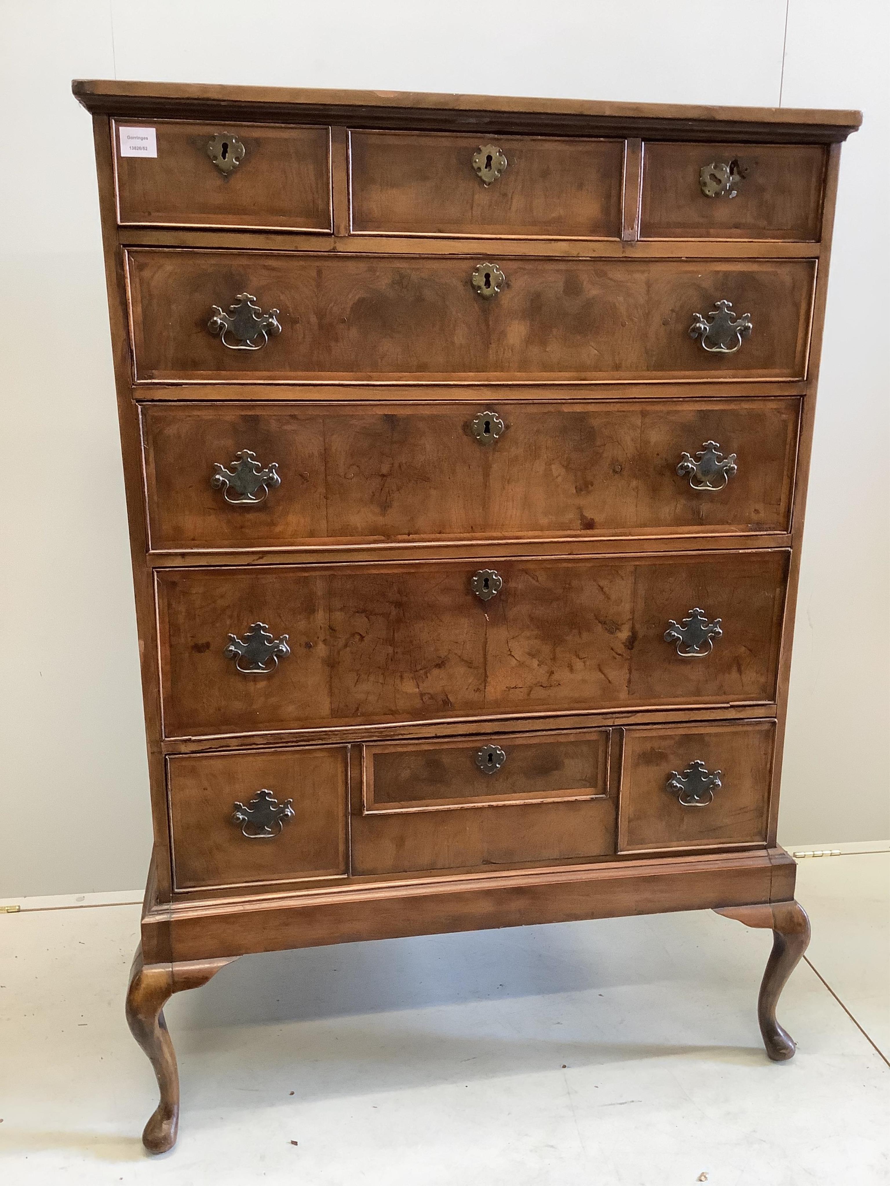 An 18th century and later feather-banded walnut chest on stand, width 96cm, depth 51cm, height