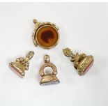 Four assorted 19th century fob seals including a 9ct and chalcedony set spinning fob, 32mm.