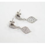 A modern pair of 750 white metal and diamond cluster set drop earrings, of elliptical form, 26mm,