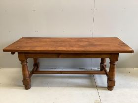 An 18th century style rectangular oak refectory dining table, (extending leaves added later),