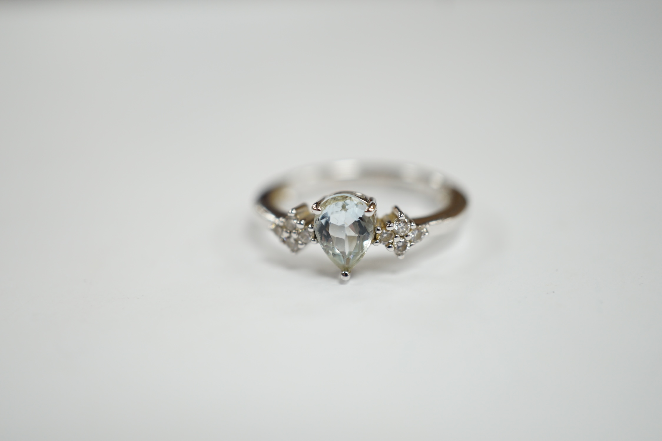 A modern Italian Comete 18k white metal and single stone pear cut aquamarine set ring, with eight - Image 2 of 3