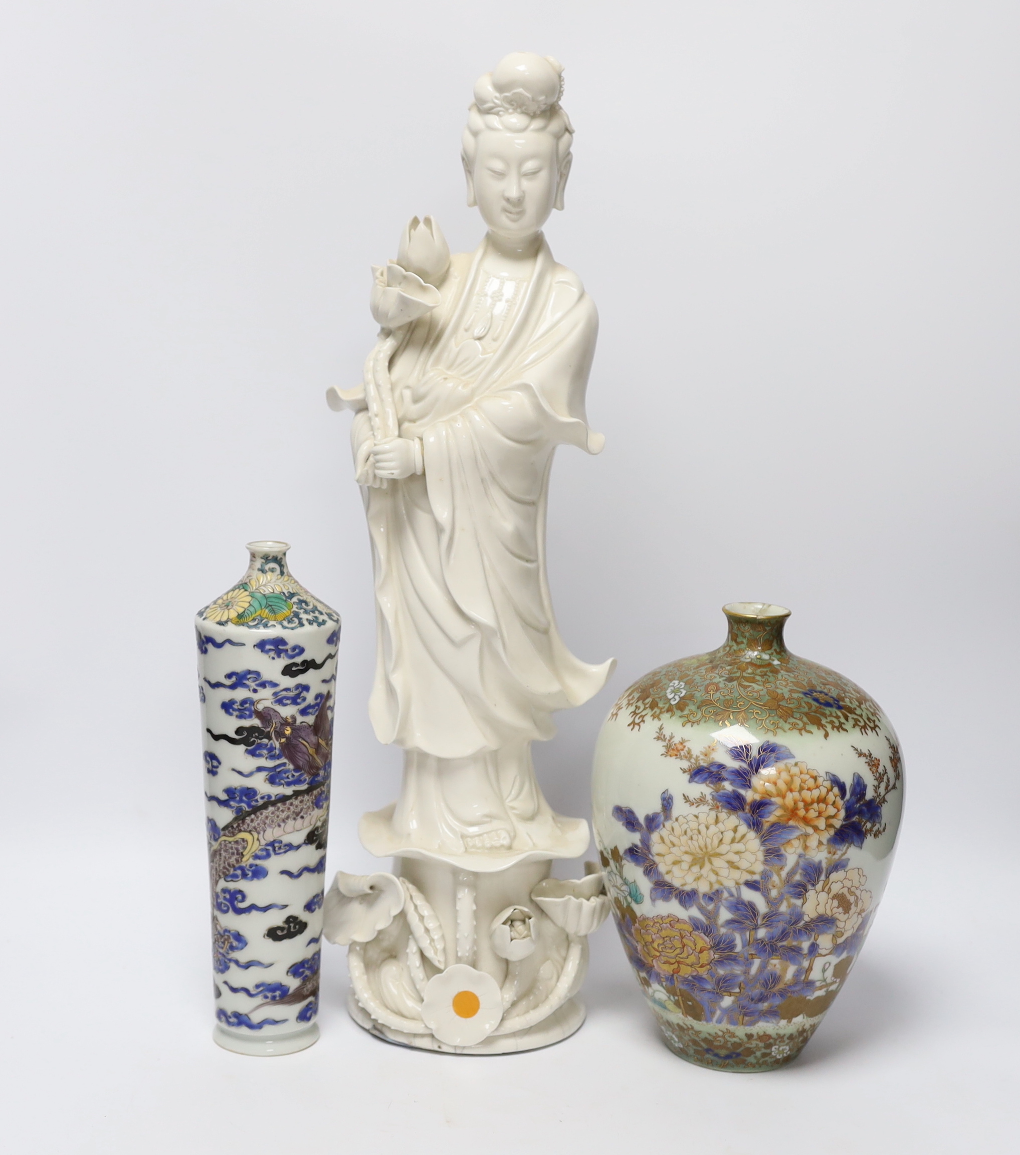 A 19th century Chinese blanc de chine figure of Guanyin, 20th century ‘dragon’ vase and a Japanese