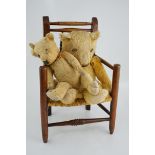 Two teddy bears and a child's chair