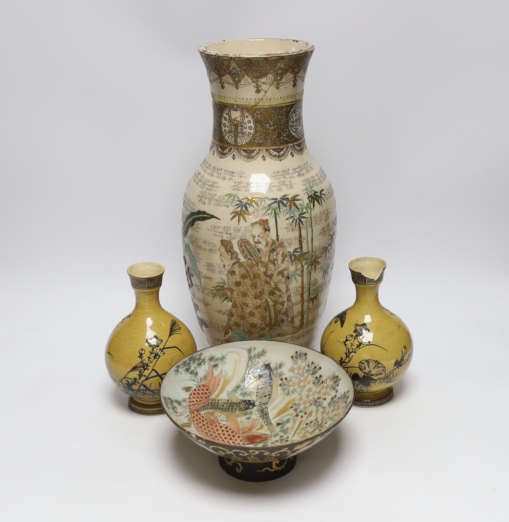 A 19th century Satsuma vase, two ochre pottery vases and a fish designed bowl, (purported to come