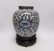 A 19th century Chinese blue and white jar and cover, with stand, 29cm total (including stand)