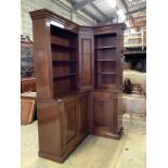 A George III style mahogany corner library bookcase, the mid section incorporating a secret