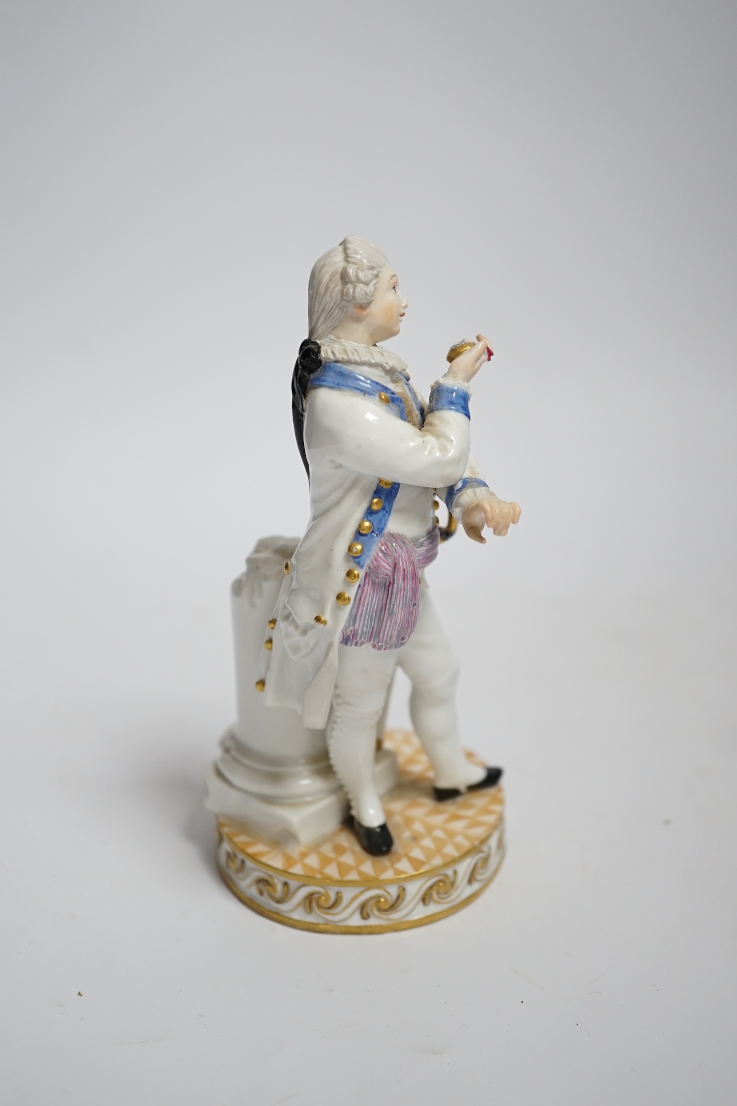 A Meissen style porcelain figure of a soldier in dress uniform with sword and holding aloft a pocket - Image 3 of 4