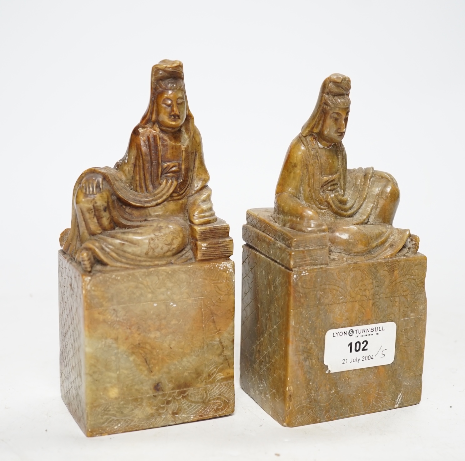 A pair of large Chinese soapstone ‘Guanyin’ seals, 16.5cm high
