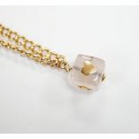 An Edwardian 15ct gold curb link bracelet, 16cm, hung with a later mounted glass cube charm, gross