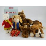 Four Steiff toys including Boxer dog and Rupert Bear