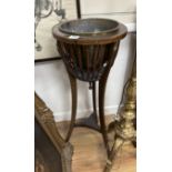 An Edwardian inlaid mahogany jardiniere with brass liner, diameter 37cm, height 93cm