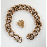 An Edwardian 9ct gold hollow curb link bracelet, with heart shaped padlock clasp(a.f.), 20cm, 23