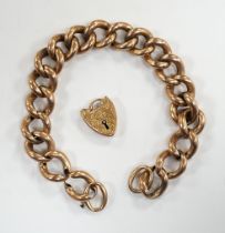 An Edwardian 9ct gold hollow curb link bracelet, with heart shaped padlock clasp(a.f.), 20cm, 23