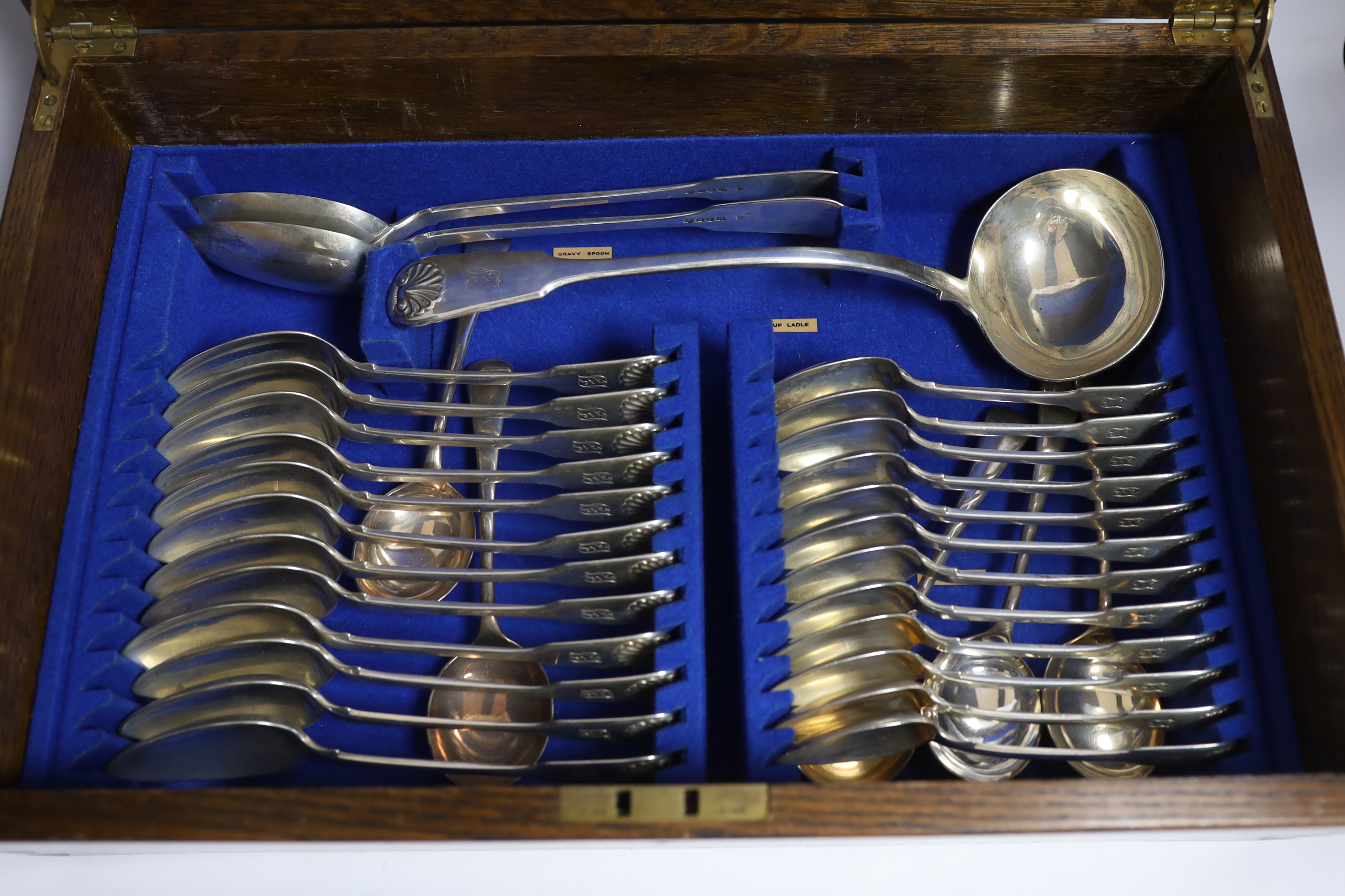 A Victorian oak cased matched canteen of silver fiddle and shell pattern flatware, by John & Henry - Image 8 of 10