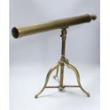 A brass tripod telescope, 65cm wide