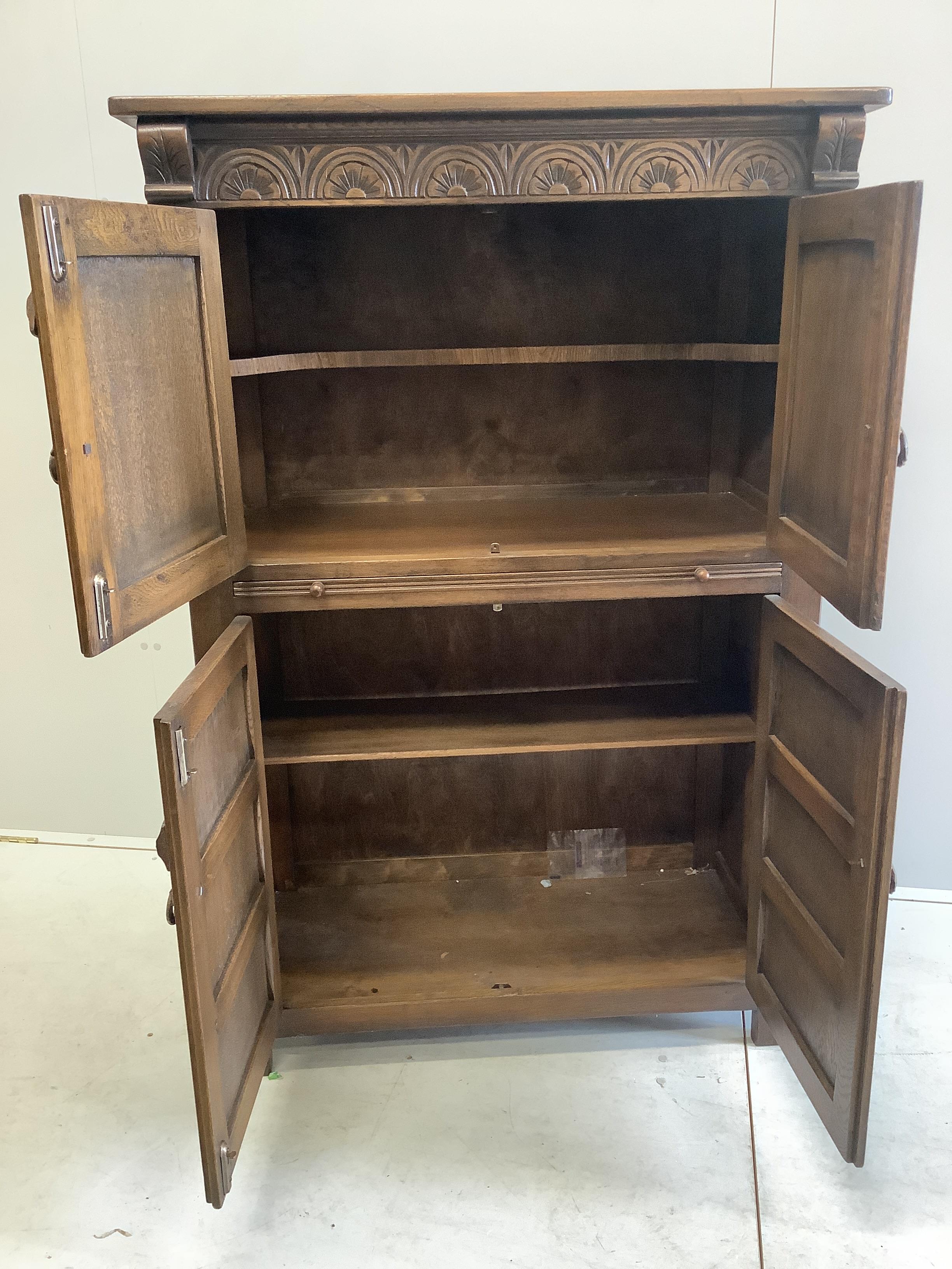 A Jacobean Revival oak cocktail cabinet, width 94cm, depth 49cm, height 139cm - Image 2 of 2