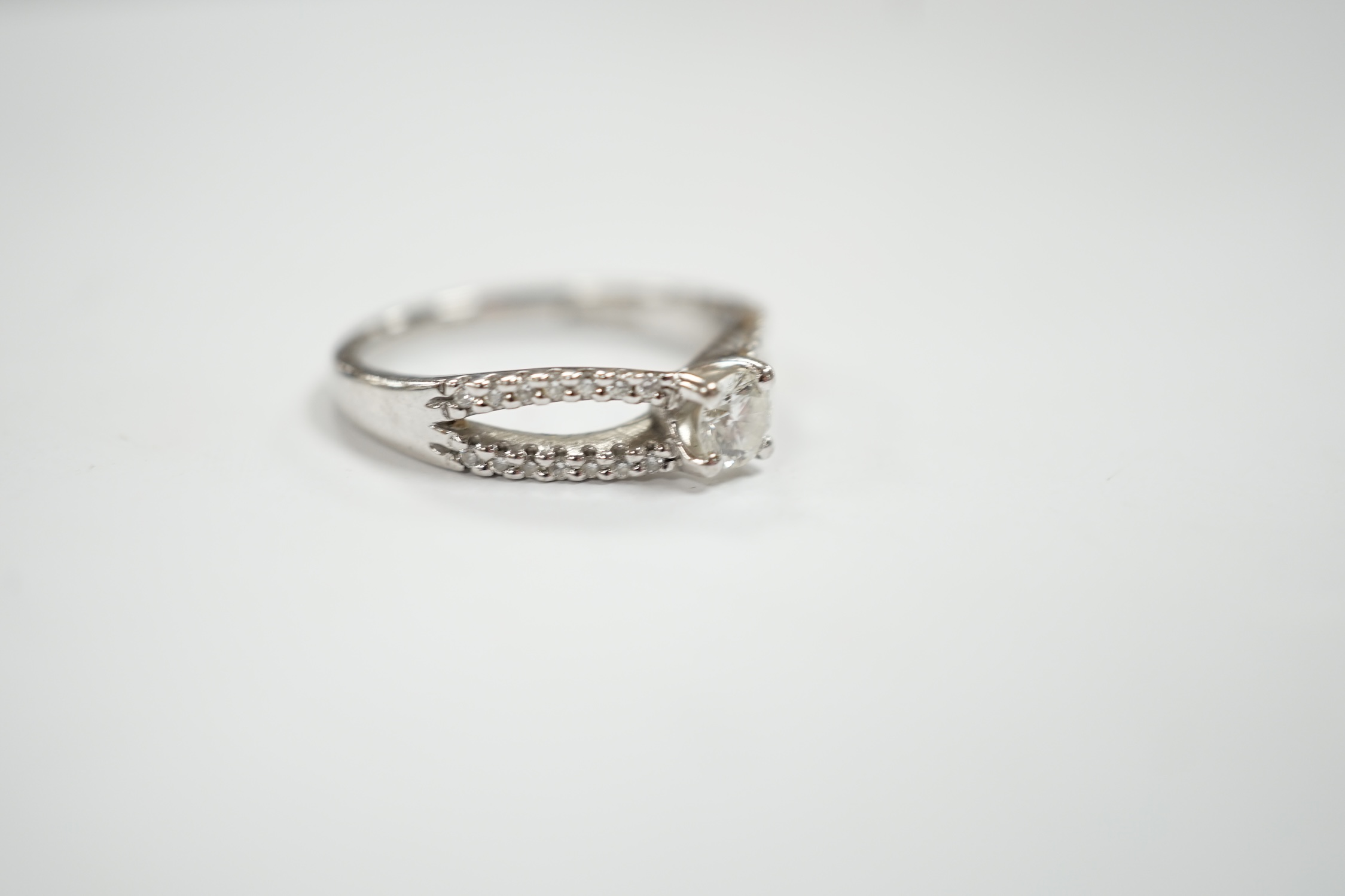 A modern 18ct white gold and single stone diamond set ring, with diamond chip set split shoulders, - Image 3 of 4