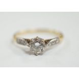 An 18ct and single stone diamond set ring, with diamond chip set shoulders, size M, gross weight 1.9