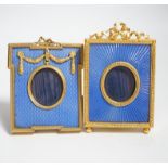 Two gilt metal and enamel miniature frames with fitted cases, largest 11cm high