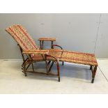 A vintage French caned bamboo reclining garden chair with footrest