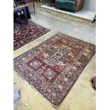 A Caucasian style red ground rug, 207 x 150cm