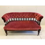 A late Victorian mahogany upholstered settee, width 132cm, depth 56cm, height 70cm