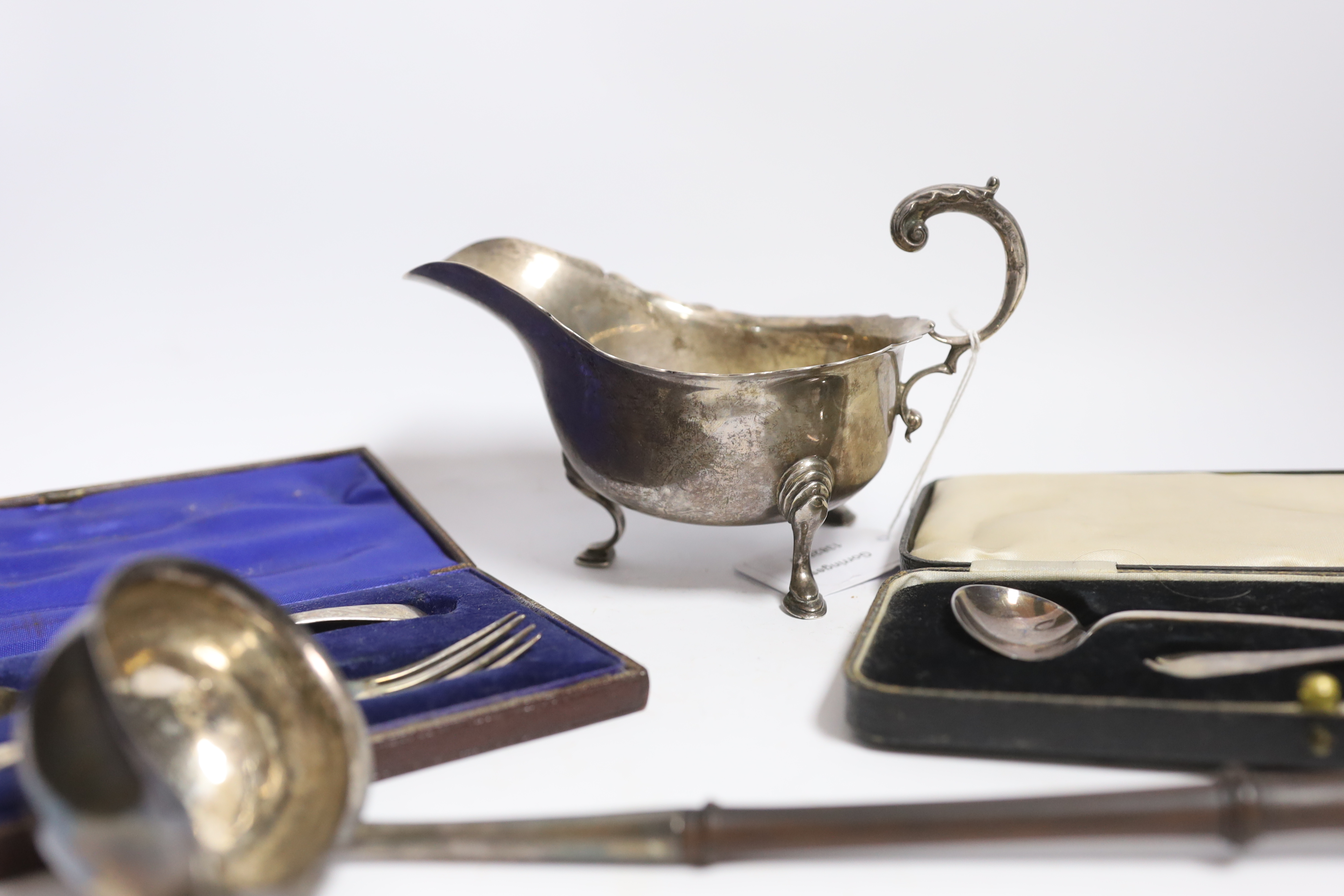 A small group of silver items to include a George V sauceboat, London, 1934, a George III toddy - Image 3 of 3